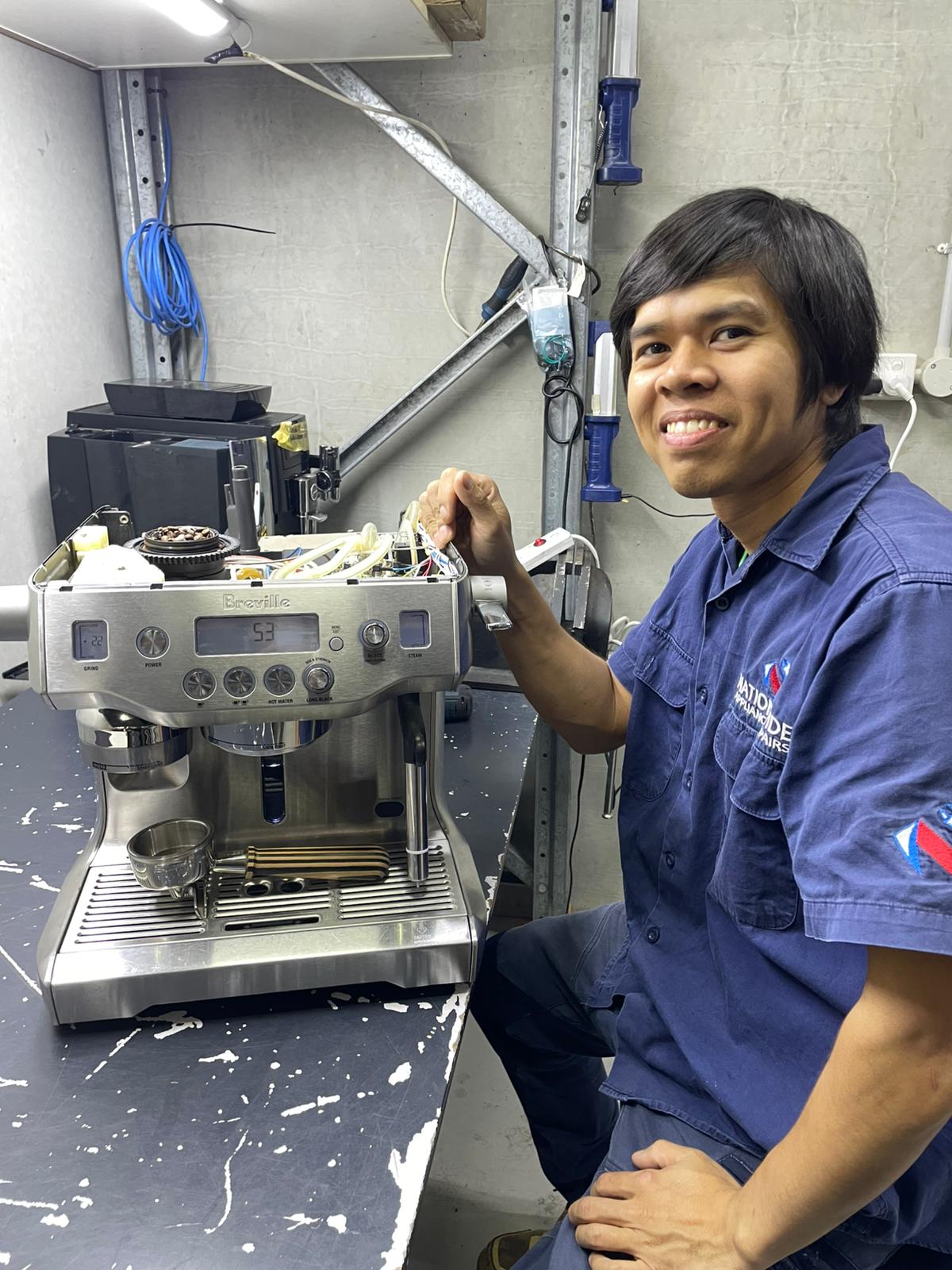 Technician repairing an appliance